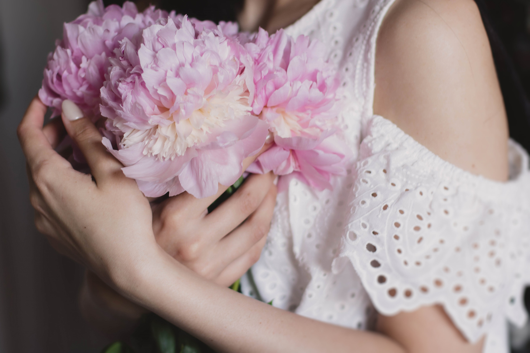 Woman holding flowers bouquet 